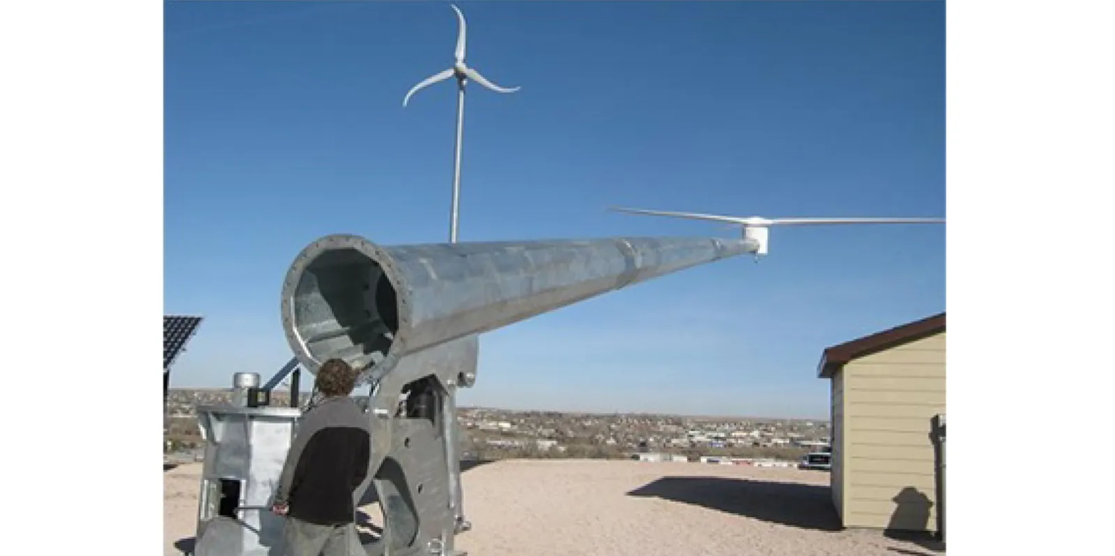 Hinged wind turbine tower that is raised and lowered using a hydraulic cylinder - Predictive Engineering FEA Services